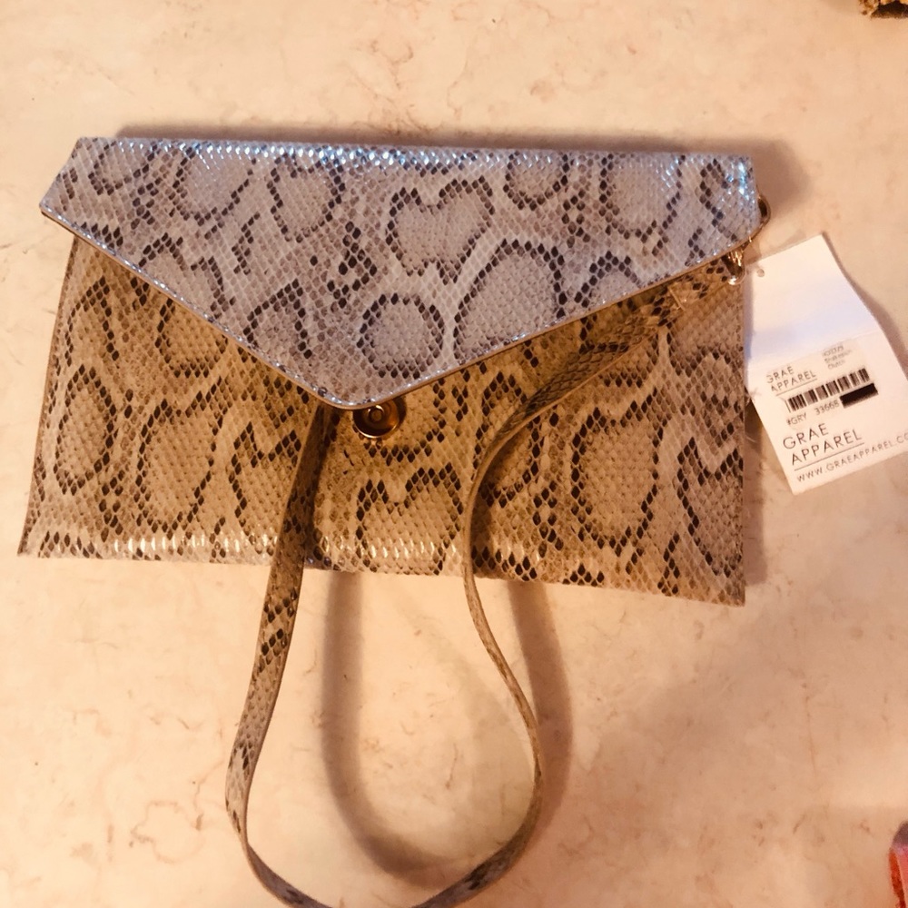 Snakeskin print clutch with strap